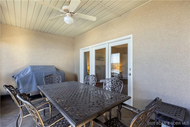 view of patio featuring ceiling fan