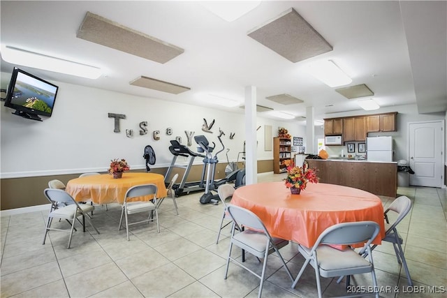 dining space with light tile patterned flooring