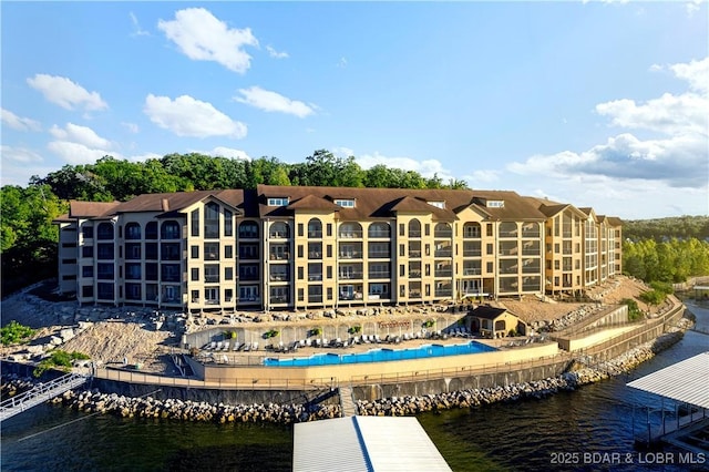 view of building exterior with a water view