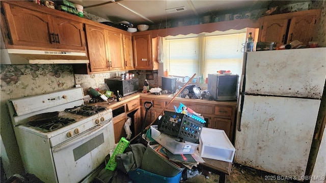 kitchen featuring white gas stove