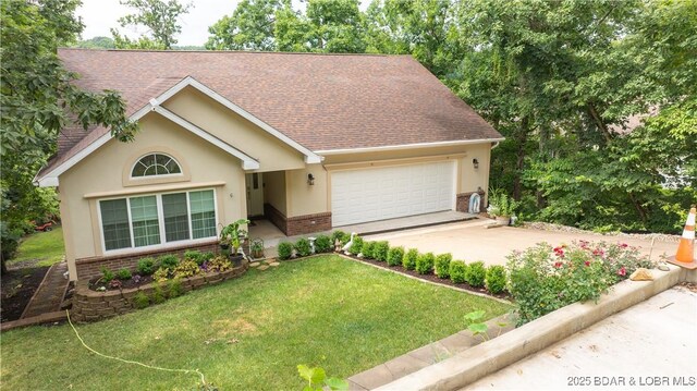 view of front of property with a garage and a front yard