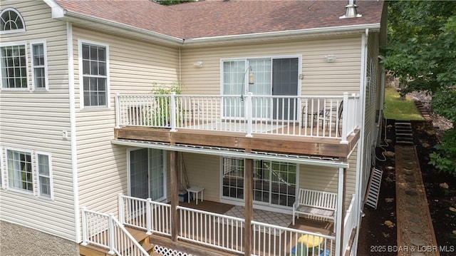 rear view of property with a balcony