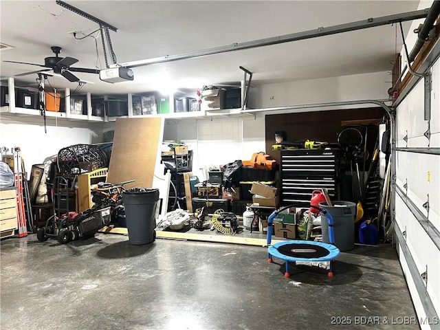 garage featuring a garage door opener and ceiling fan