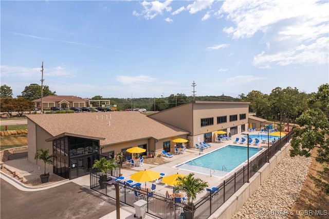 view of swimming pool with a patio area