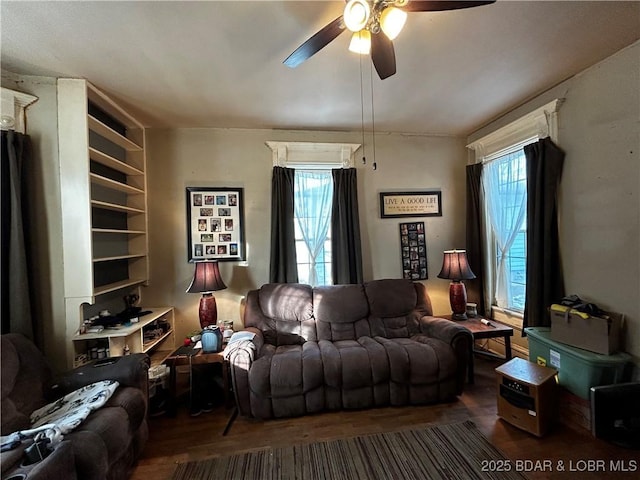 living room featuring hardwood / wood-style flooring, a wealth of natural light, and ceiling fan