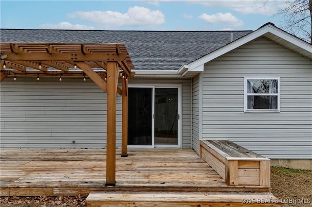 property entrance featuring a deck and a pergola