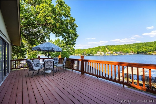 wooden deck with a water view