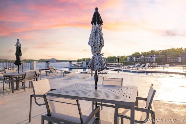 view of patio terrace at dusk