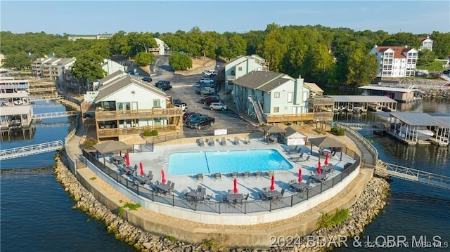 birds eye view of property featuring a water view