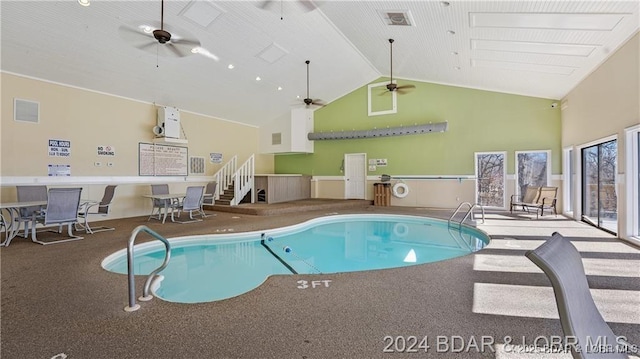 view of pool featuring ceiling fan and a jacuzzi