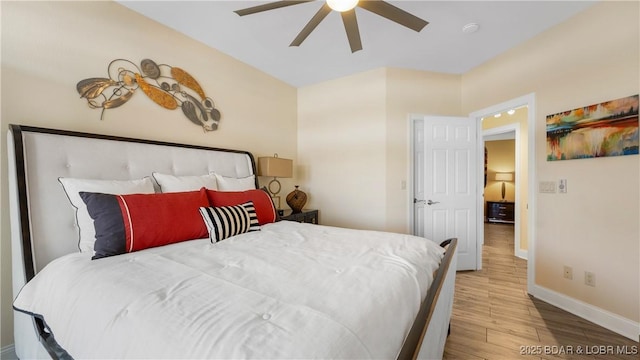 bedroom with ceiling fan and light hardwood / wood-style flooring