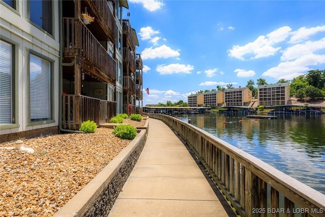 surrounding community featuring a water view