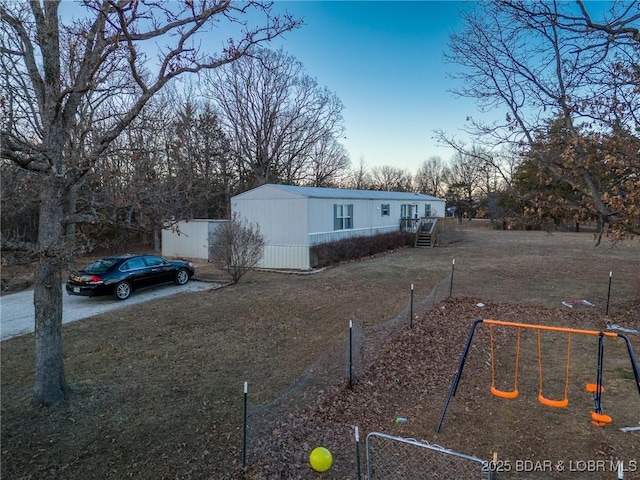 view of front of home with a playground