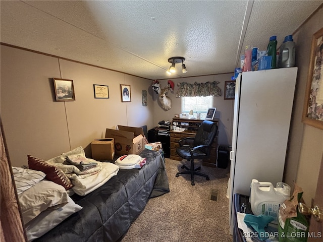 bedroom featuring ornamental molding, carpet flooring, and a textured ceiling