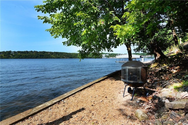 view of water feature featuring an outdoor fire pit