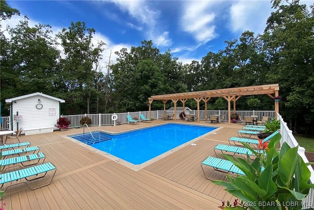 view of swimming pool featuring a pergola and a deck