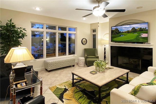 living room with ceiling fan and light tile patterned floors