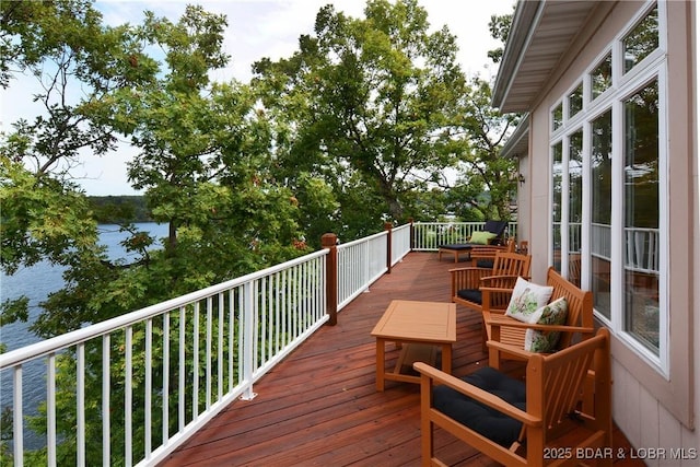 wooden deck with a water view