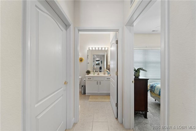 hallway with light tile patterned floors