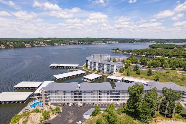 birds eye view of property with a water view