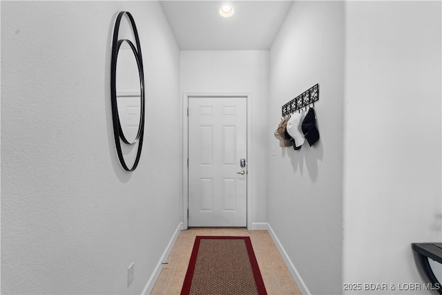 doorway to outside featuring light tile patterned floors