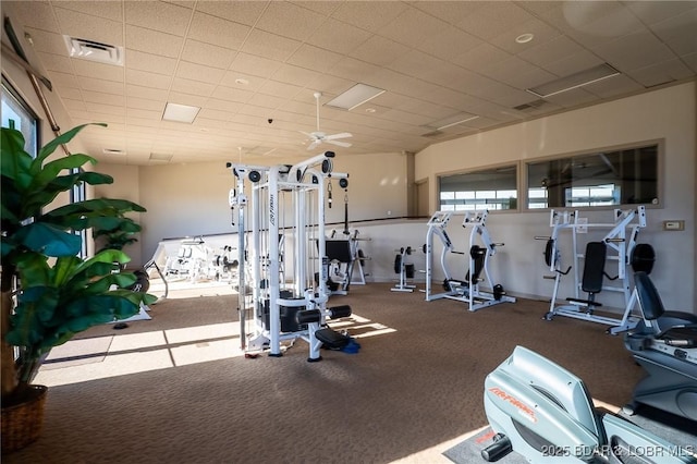 gym featuring a drop ceiling