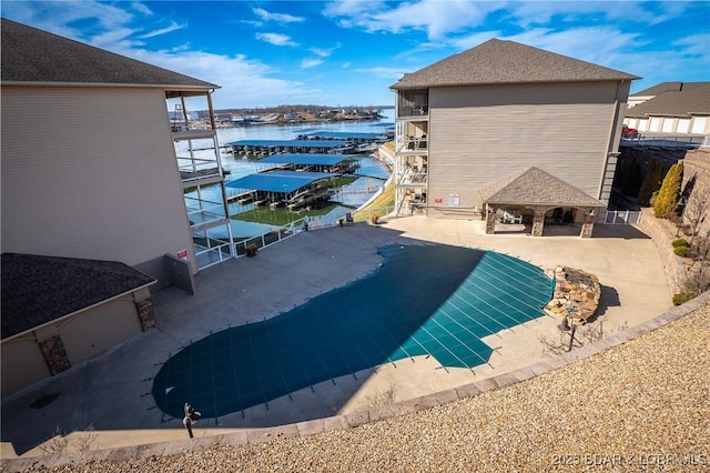 view of swimming pool with a water view and a gazebo