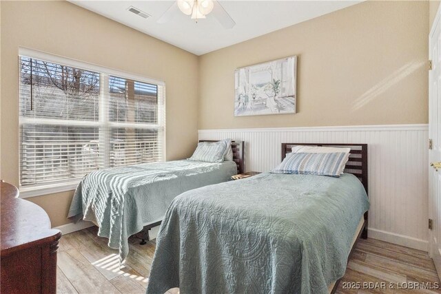 bedroom featuring wood-type flooring and ceiling fan