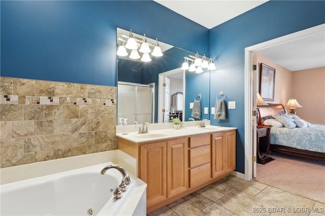 bathroom with tile patterned floors, vanity, and independent shower and bath