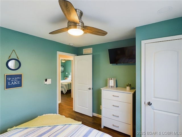 bedroom featuring dark wood-type flooring and ceiling fan