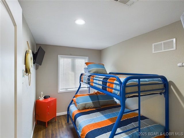 bedroom featuring dark hardwood / wood-style floors