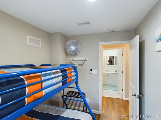 bedroom with hardwood / wood-style floors