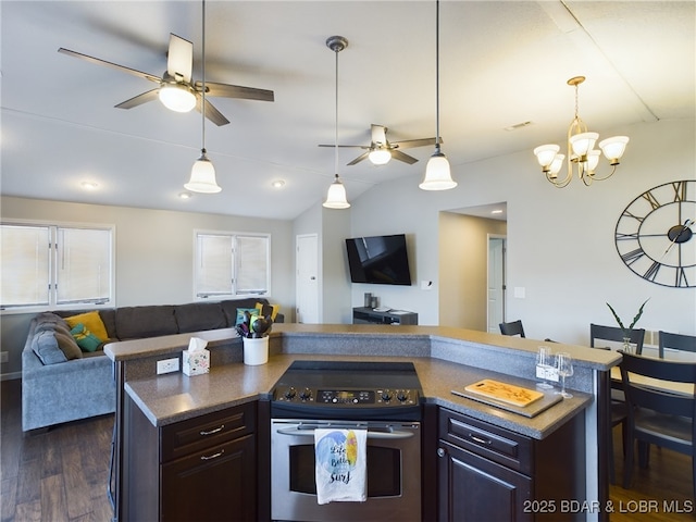 kitchen with dark wood-type flooring, vaulted ceiling, dark brown cabinets, stainless steel electric range, and an island with sink