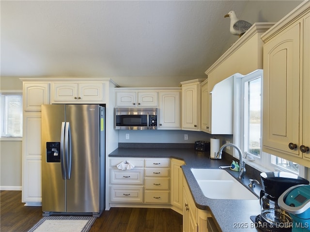 kitchen featuring stainless steel appliances, sink, and plenty of natural light