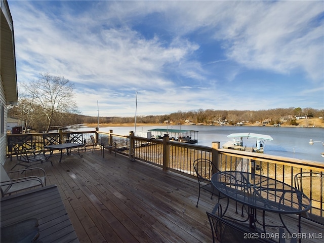 wooden terrace with a water view