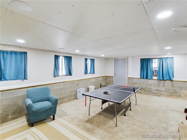 playroom featuring concrete flooring