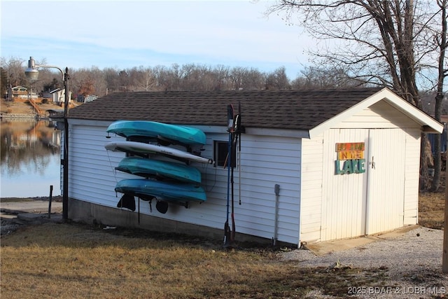 view of outbuilding with a water view