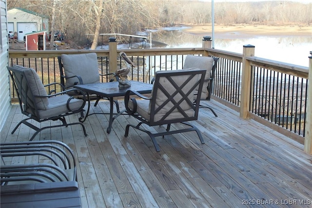 deck featuring a water view