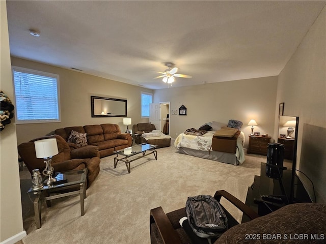 bedroom with multiple windows, carpet flooring, and ceiling fan