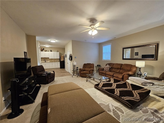 living room featuring ceiling fan and light carpet