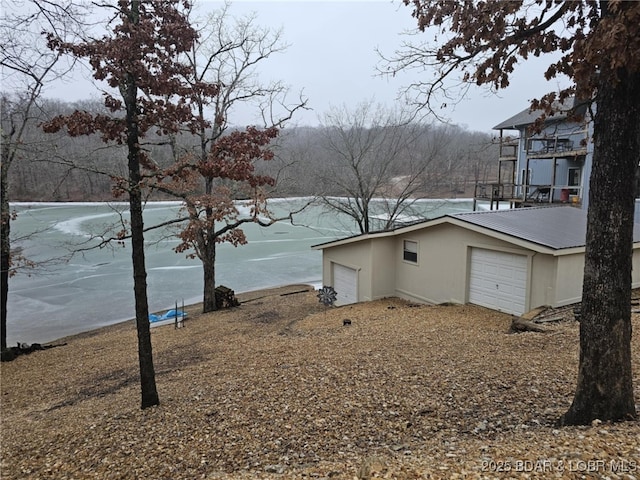 view of side of property with a garage