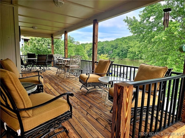 wooden terrace with a water view