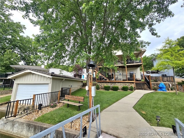 view of front of house with a garage and a front lawn