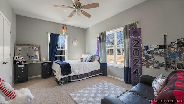 carpeted bedroom featuring ceiling fan