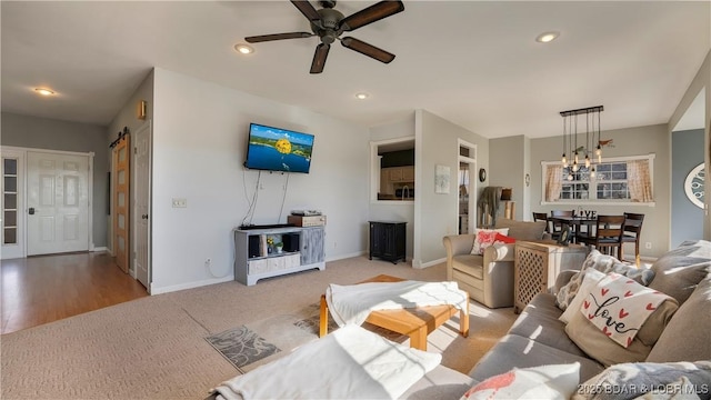 carpeted living room with ceiling fan