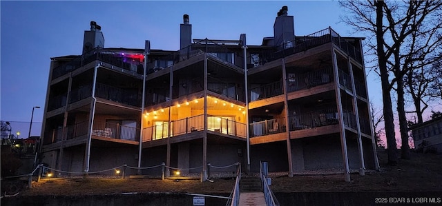 view of back house at dusk