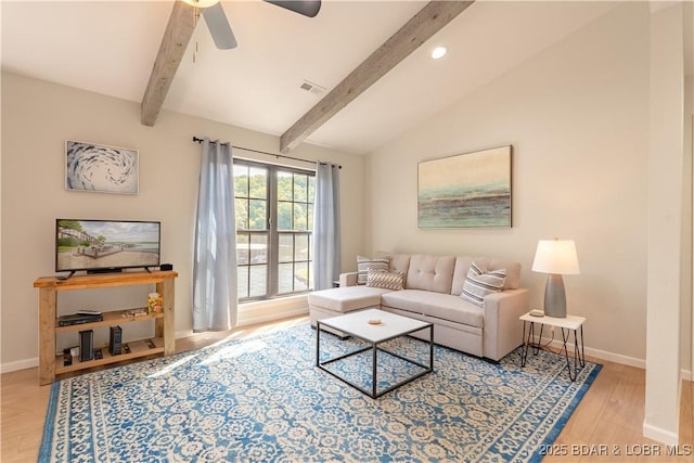 living room featuring wood-type flooring, vaulted ceiling with beams, and ceiling fan