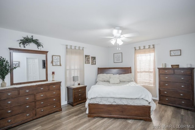 bedroom featuring hardwood / wood-style flooring and ceiling fan