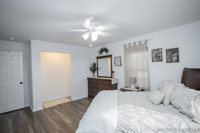 bedroom with dark hardwood / wood-style floors and ceiling fan