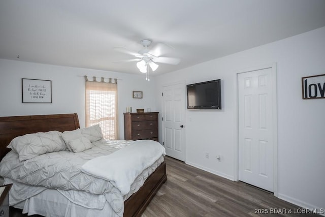 bedroom featuring dark wood-type flooring and ceiling fan